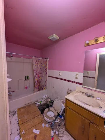 a bathroom with a sink and a mirror