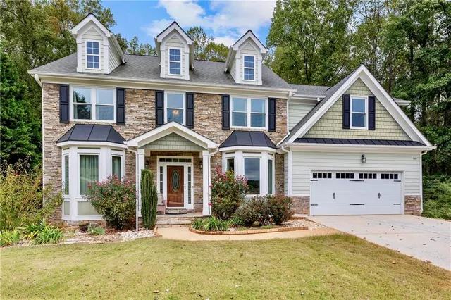 front view of a house with a yard
