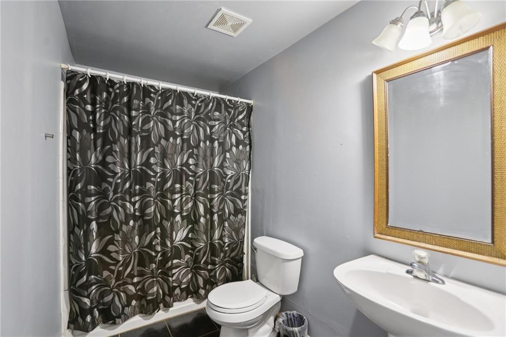 419 Long Shore Way Newnan, GA 30265 - Photo 18 of 29 a bathroom with a sink toilet and shower