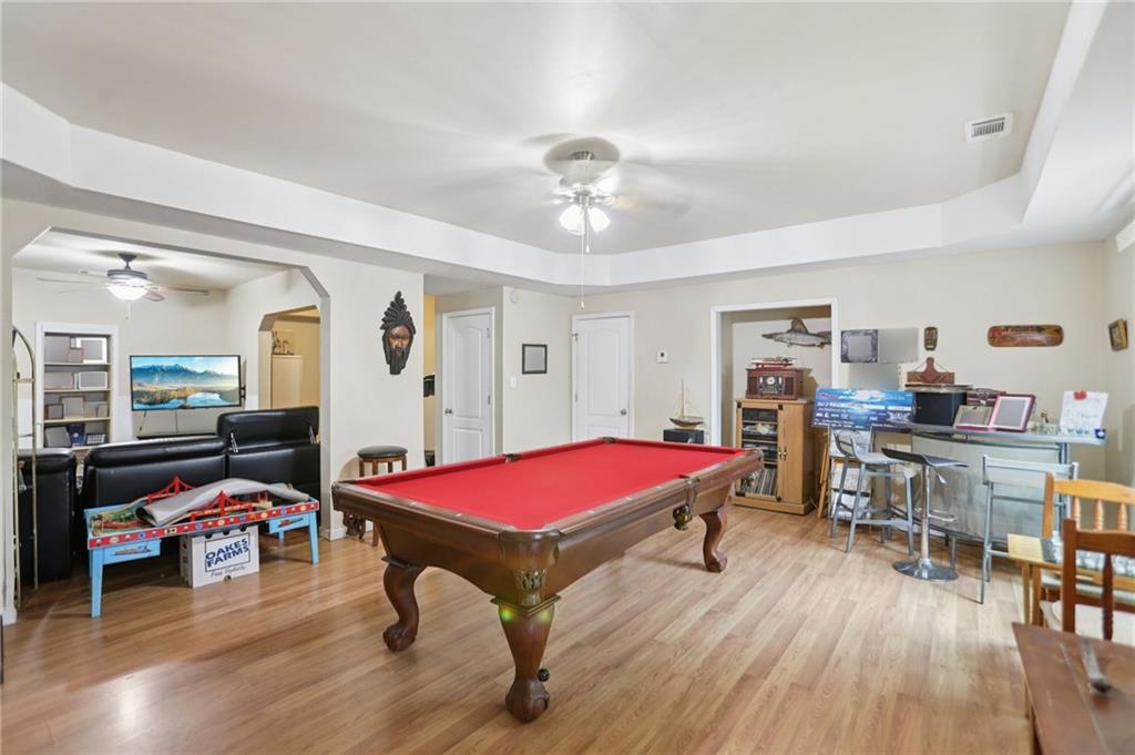 419 Long Shore Way Newnan, GA 30265 - Photo 19 of 29 a room with furniture and wooden floor