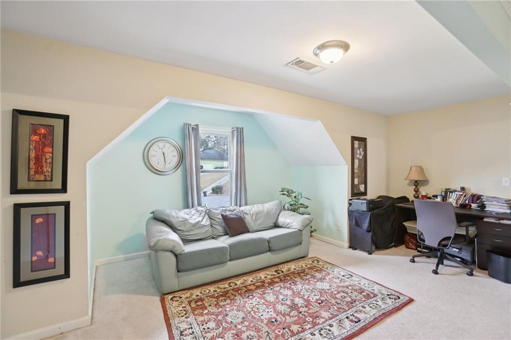 419 Long Shore Way Newnan, GA 30265 - Photo 25 of 29 a living room with furniture and a rug