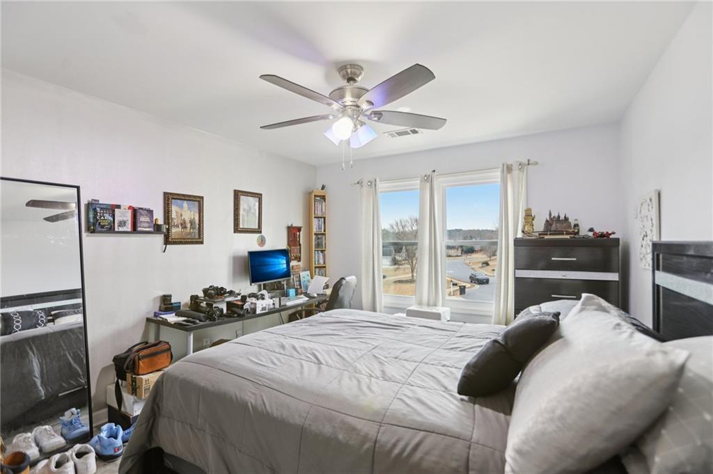 419 Long Shore Way Newnan, GA 30265 - Photo 28 of 29 a bedroom with a bed furniture and a large window