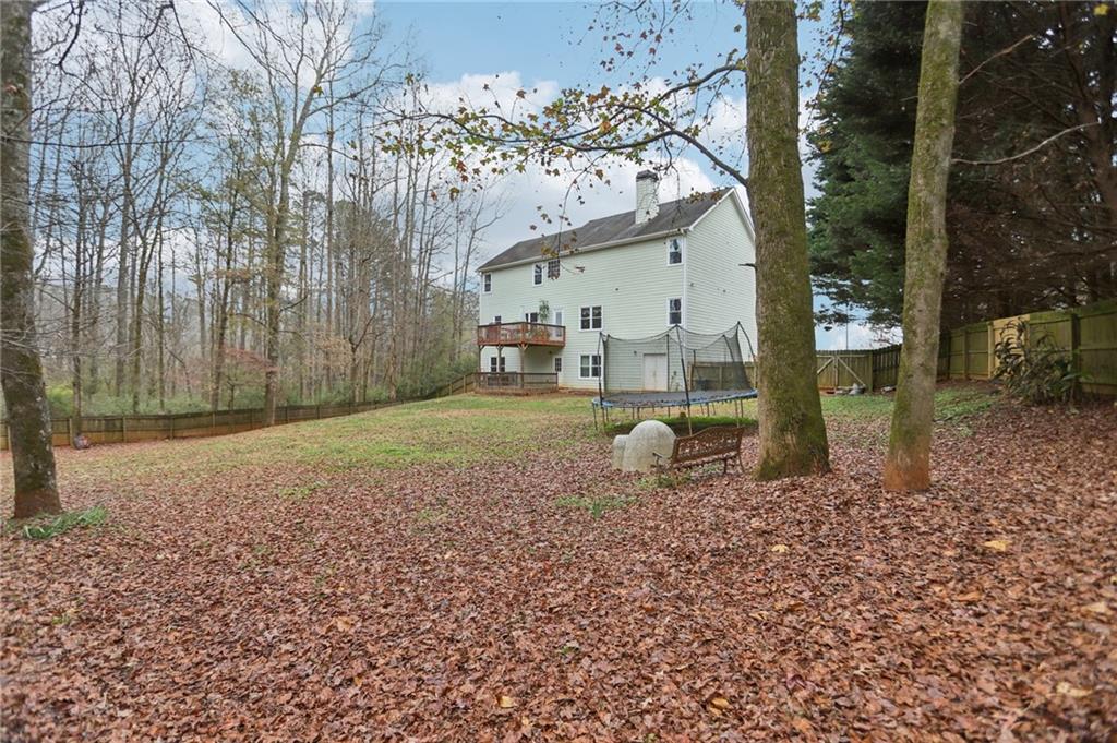 419 Long Shore Way Newnan, GA 30265 - Photo 29 of 29 a backyard of a house with barbeque oven