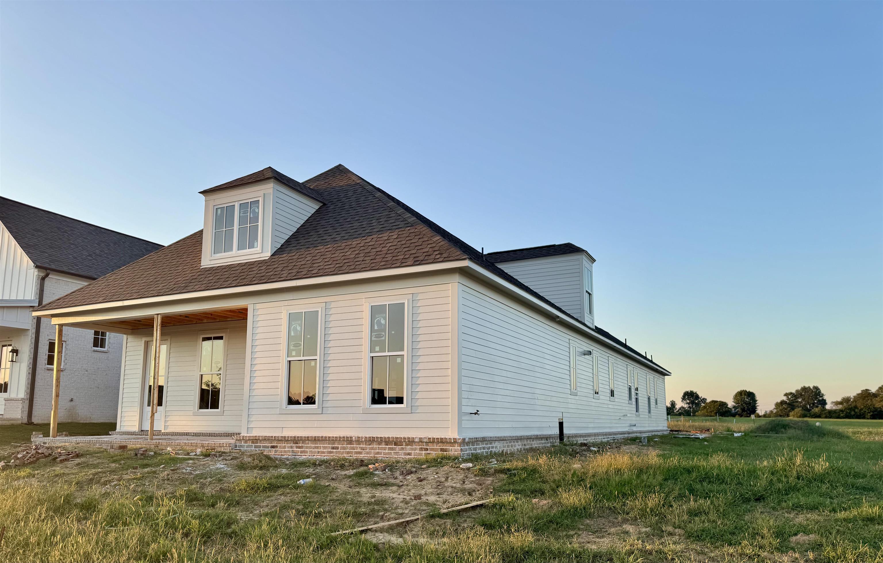 20 Rambling Rex Trail Piperton, TN 38017 - Photo 3 of 5 a front view of a house with a garden