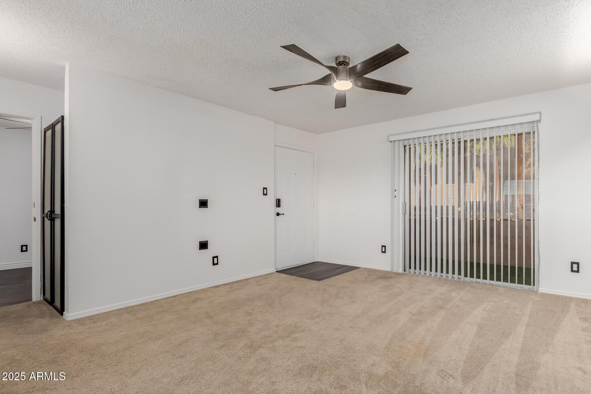 2625 East Indian School Road, Unit 238 Phoenix, AZ 85016 - Photo 1 of 29 a view of a livingroom with a ceiling fan and window