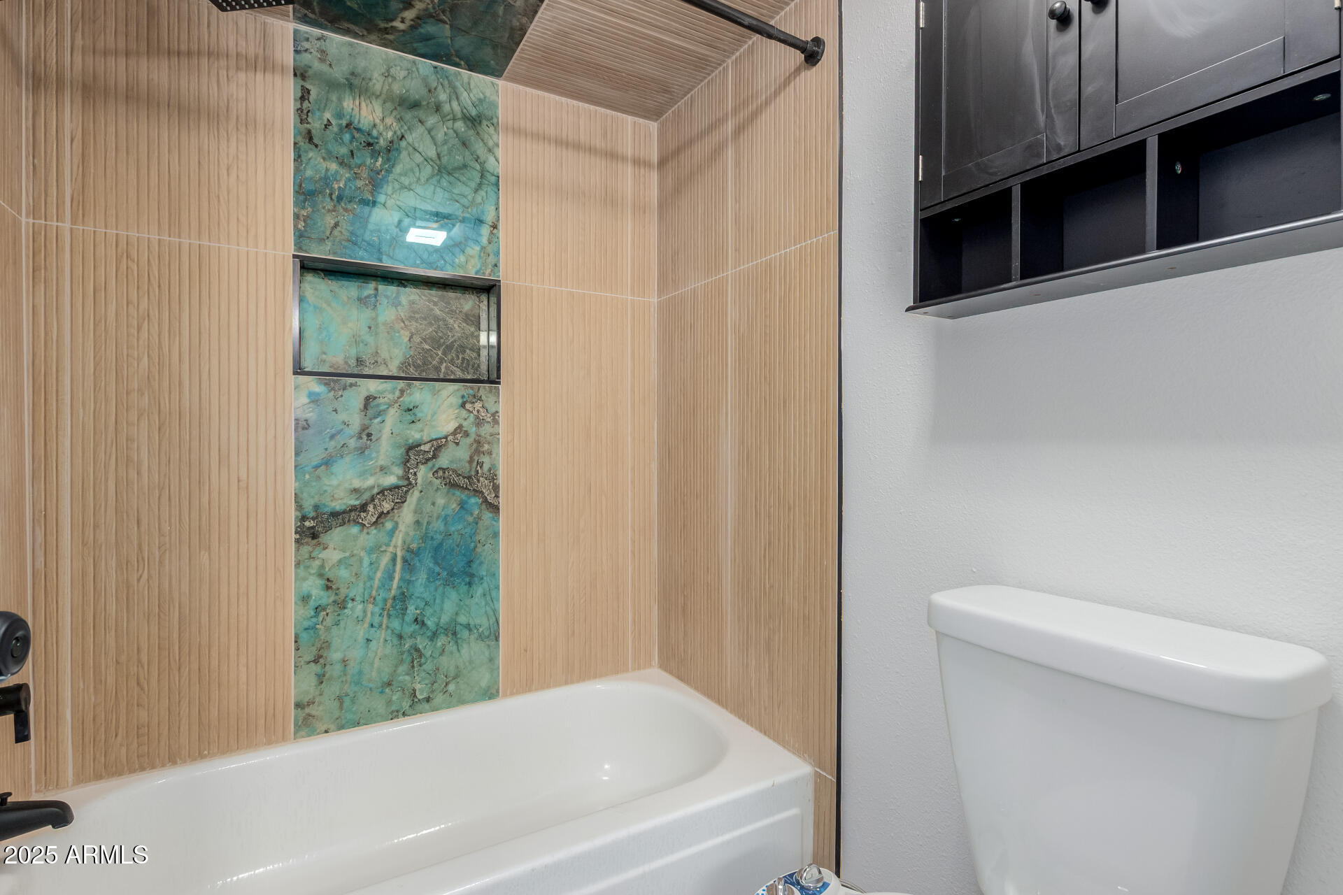 2625 East Indian School Road, Unit 238 Phoenix, AZ 85016 - Photo 12 of 29 a bathroom with a shower and a toilet