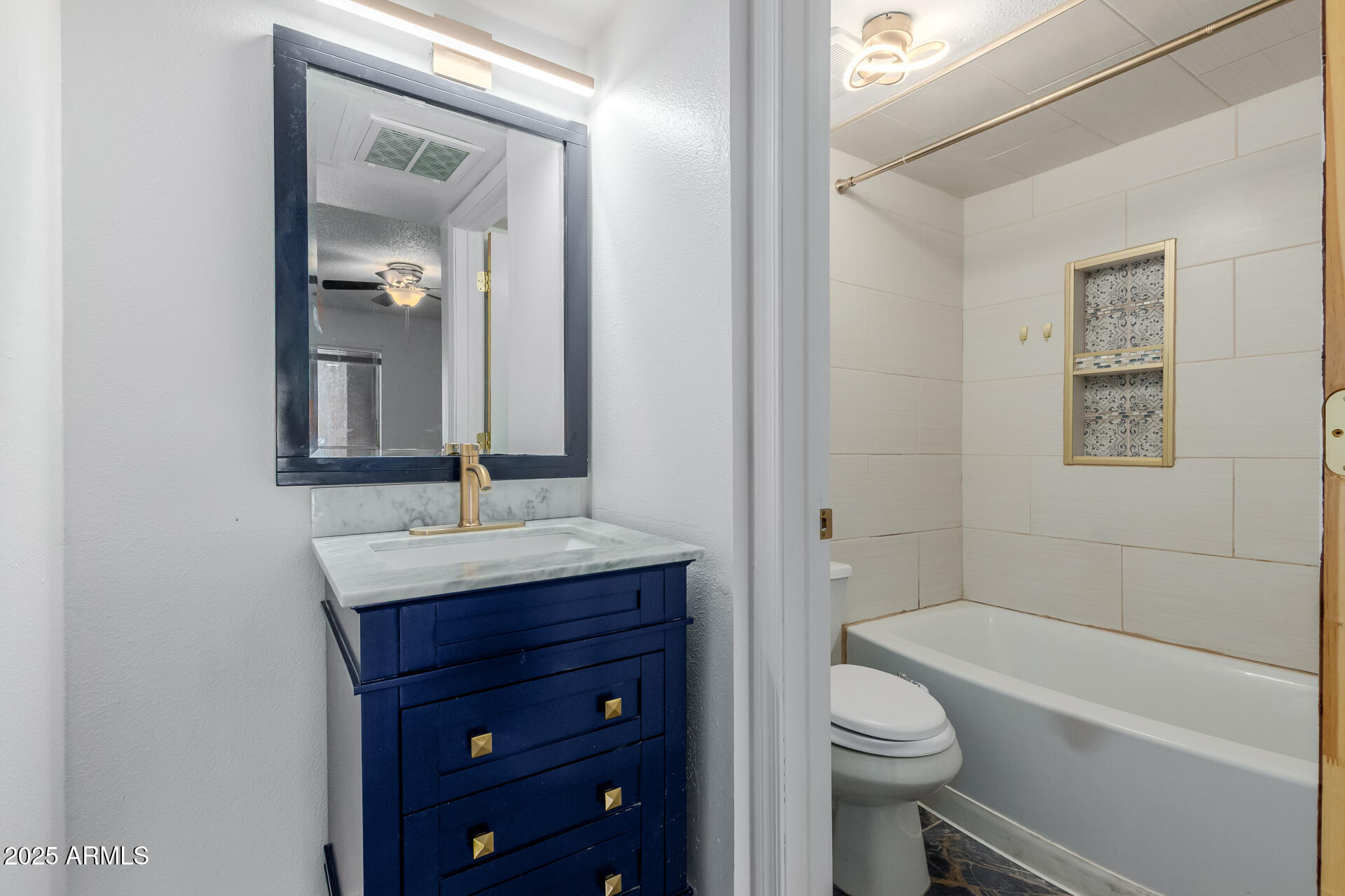 2625 East Indian School Road, Unit 238 Phoenix, AZ 85016 - Photo 15 of 29 a bathroom with a sink a toilet and shower