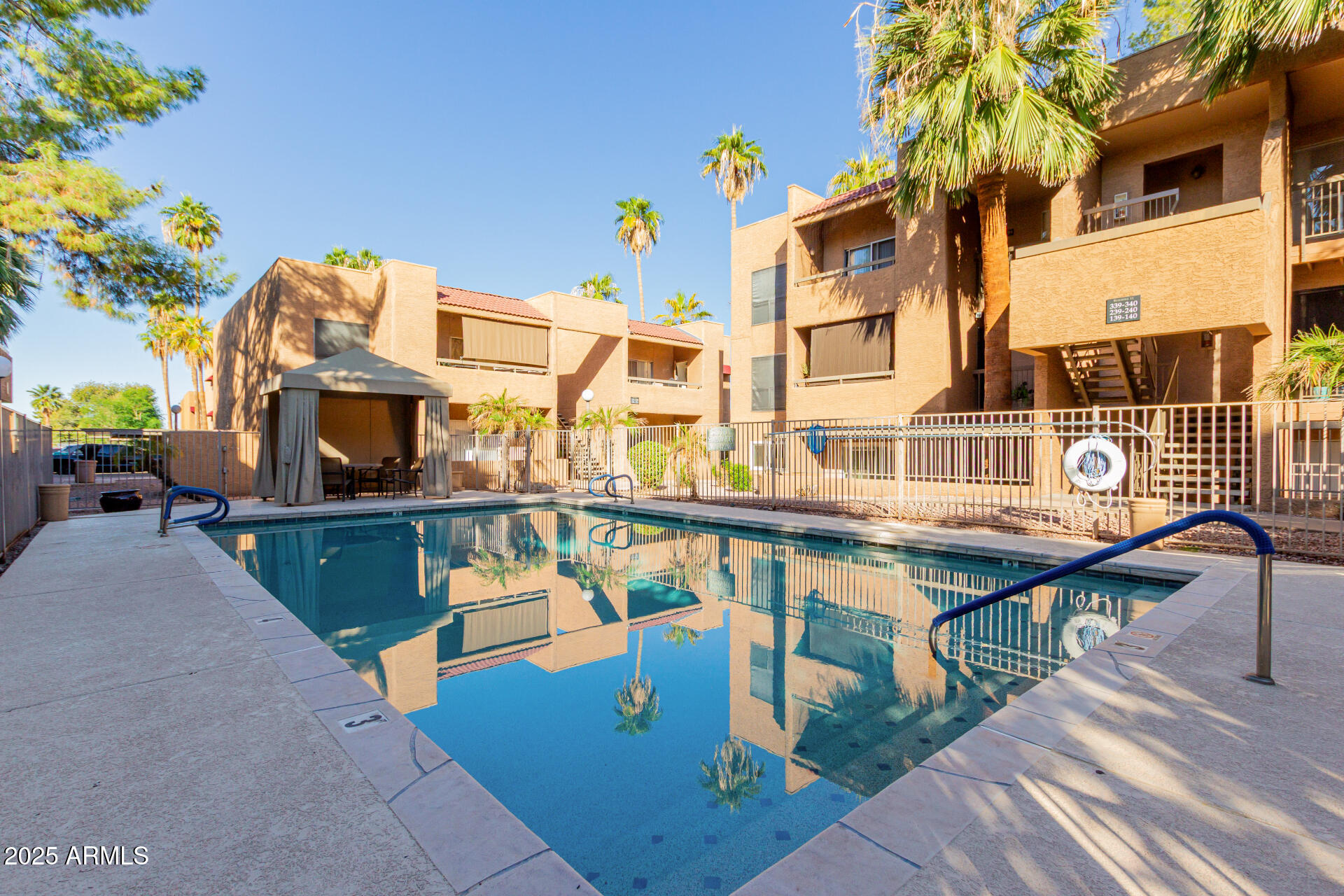 2625 East Indian School Road, Unit 238 Phoenix, AZ 85016 - Photo 23 of 29 a balcony with table and chairs