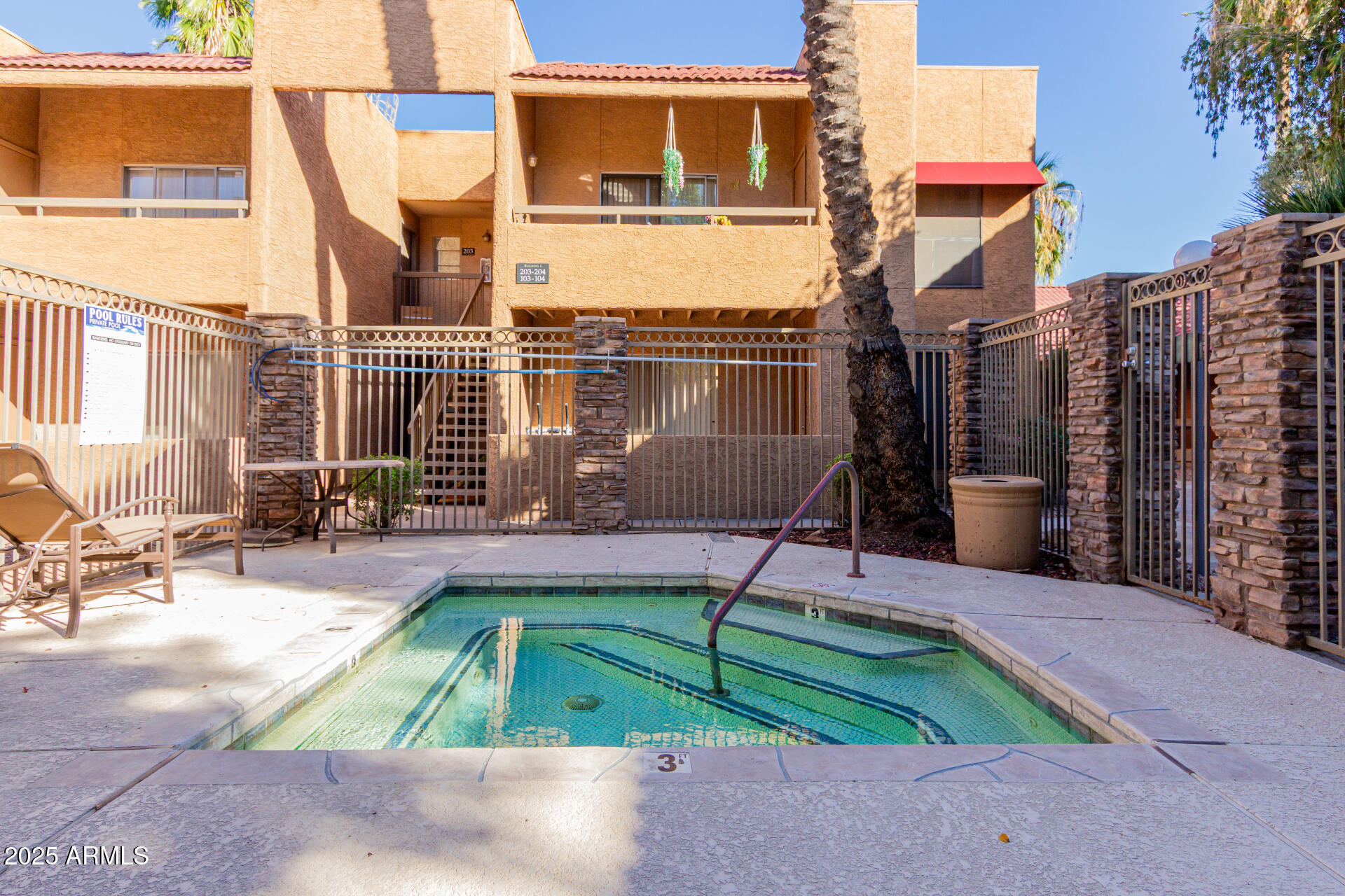 2625 East Indian School Road, Unit 238 Phoenix, AZ 85016 - Photo 27 of 29 a view of a patio with a table and chairs