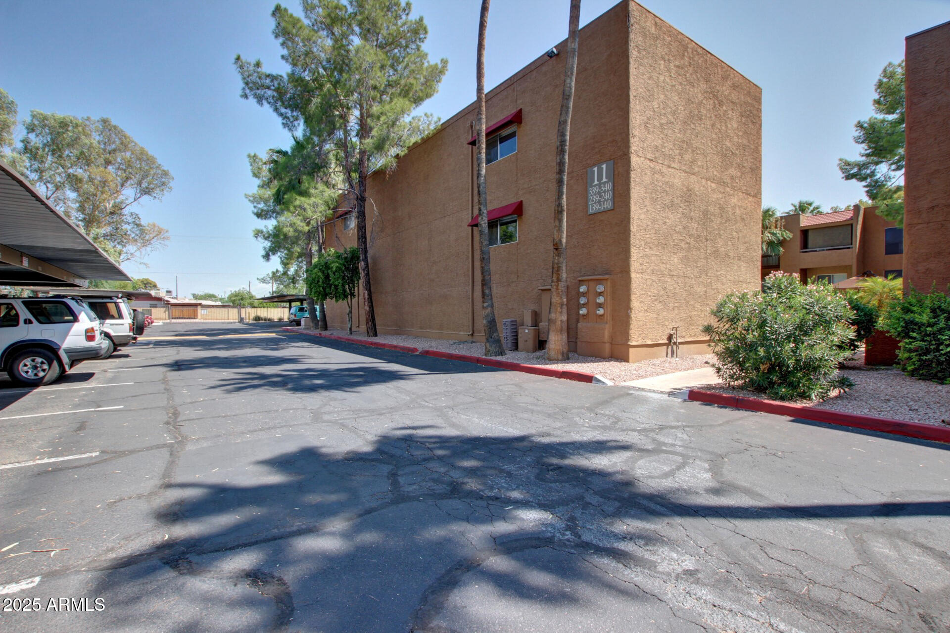 2625 East Indian School Road, Unit 238 Phoenix, AZ 85016 - Photo 29 of 29 a view of street with parked cars