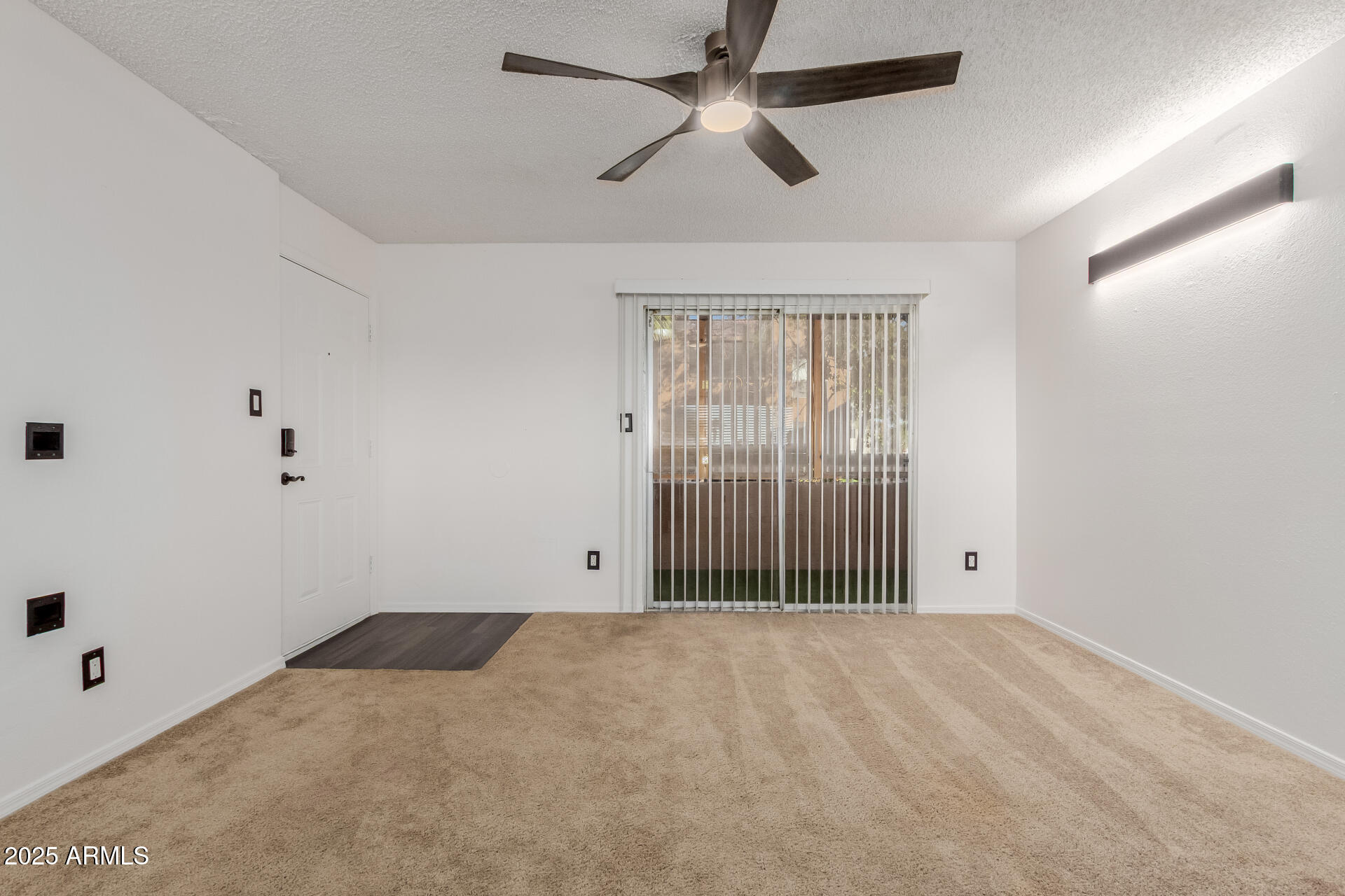 2625 East Indian School Road, Unit 238 Phoenix, AZ 85016 - Photo 3 of 29 a view of empty room with ceiling fan