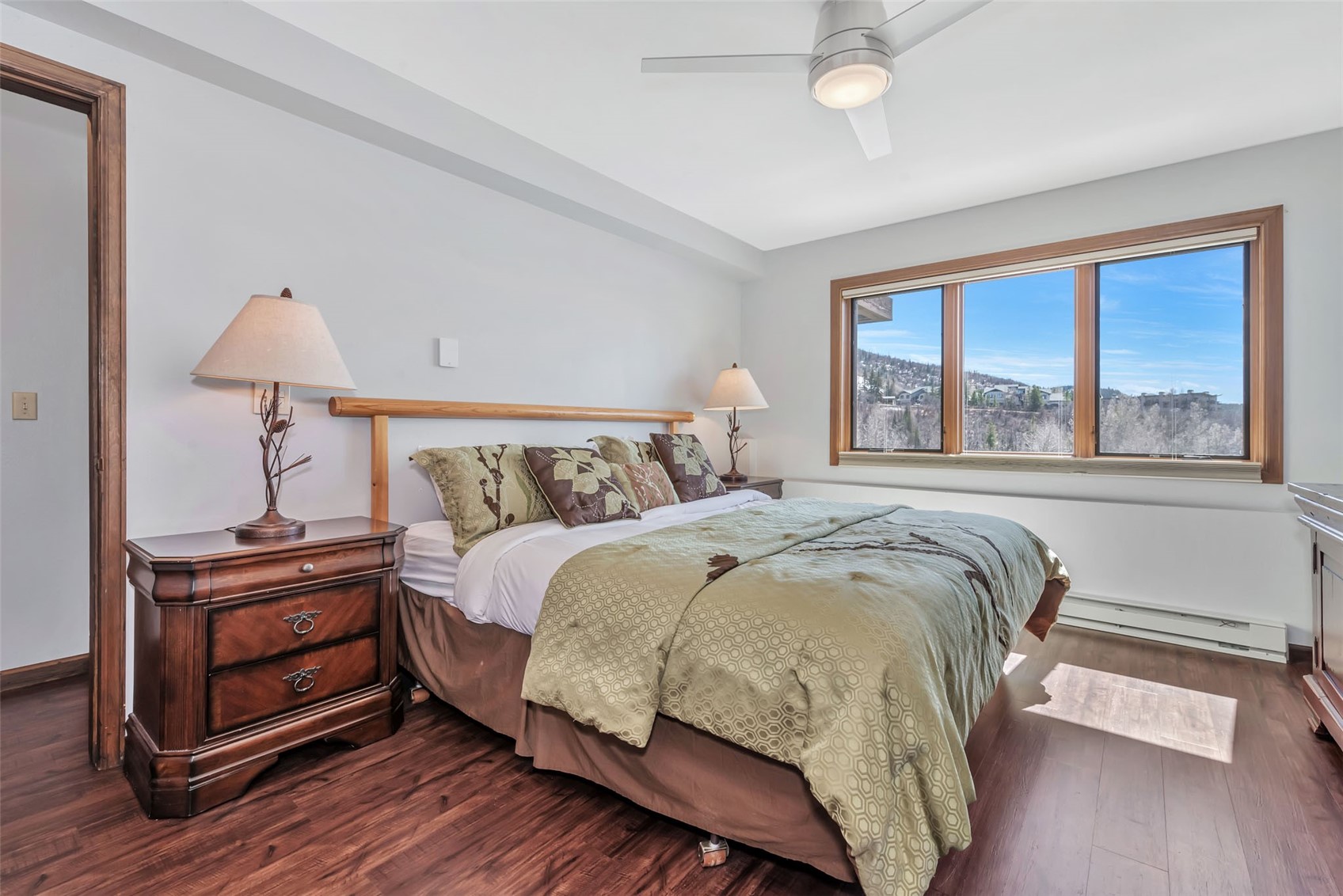 1720 Ranch Road, Unit 309 Steamboat Springs, CO 80487 - Photo 21 of 43 a bedroom with a bed and a night stand
