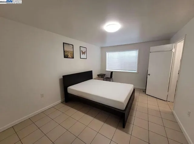 a room with a bed and a window