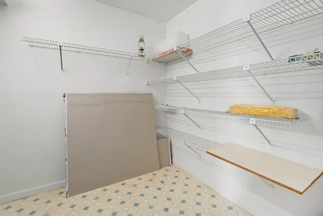 a view of a balcony with many potted plants