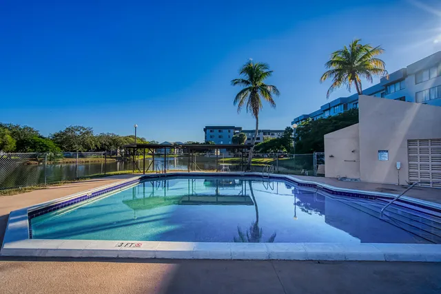 a view of a lake with houses in the back