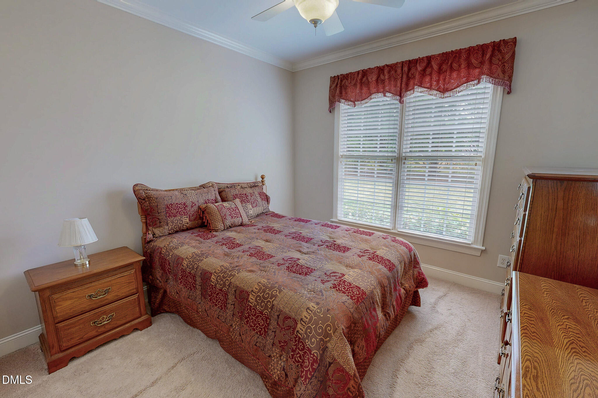 115 Duncan Plantation Road Timberlake, NC 27583 - Photo 34 of 48 a bed sitting in a bedroom next to a window