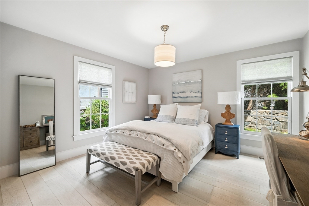 131 Front Street Marblehead, MA 01945 - Photo 14 of 41 a bedroom with a bed and a chandelier