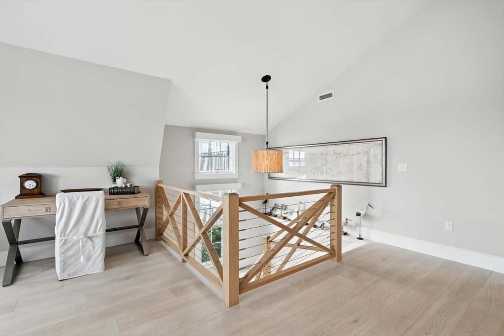 131 Front Street Marblehead, MA 01945 - Photo 19 of 41 a bedroom with furniture and a window