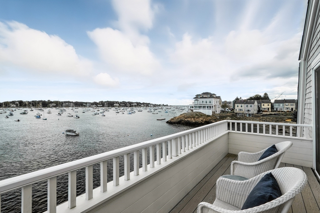 131 Front Street Marblehead, MA 01945 - Photo 22 of 41 a view of a balcony with wooden chairs