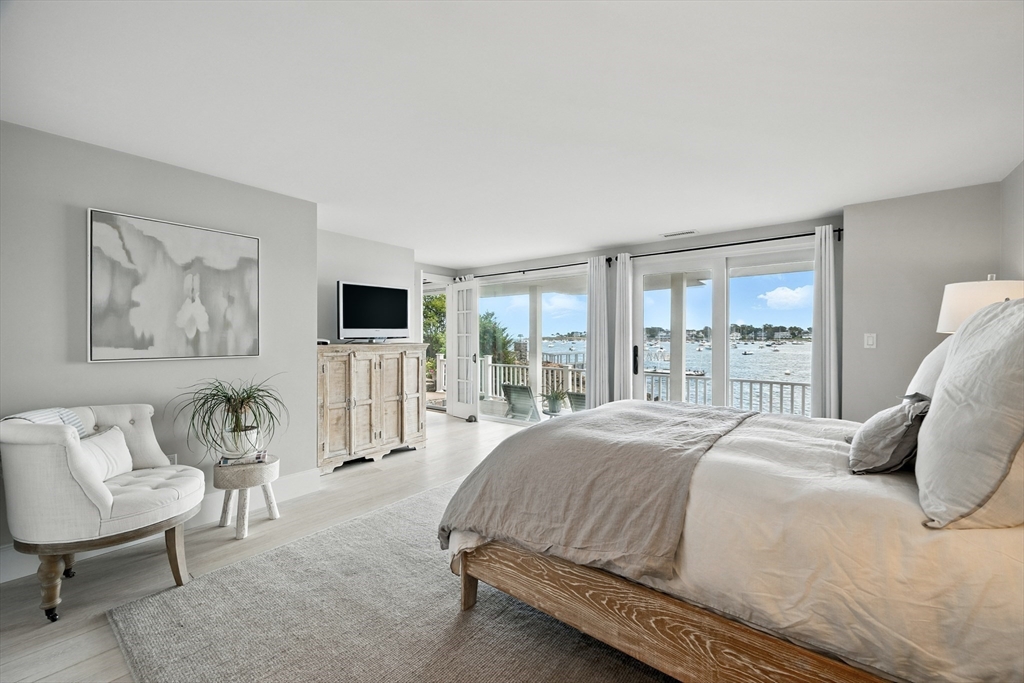 131 Front Street Marblehead, MA 01945 - Photo 27 of 41 a bedroom with a large bed and windows