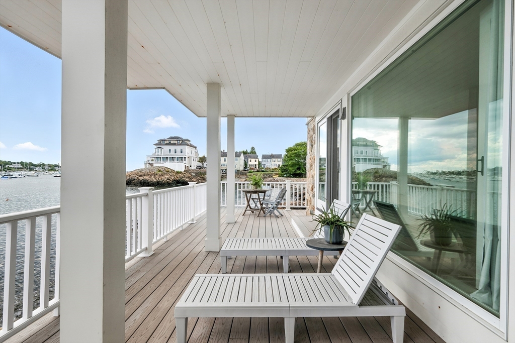 131 Front Street Marblehead, MA 01945 - Photo 32 of 41 a view of a living room with a floor to ceiling window and wooden floor