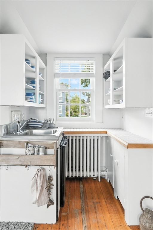 131 Front Street Marblehead, MA 01945 - Photo 34 of 41 a spacious bathroom with a sink a mirror and next to a window
