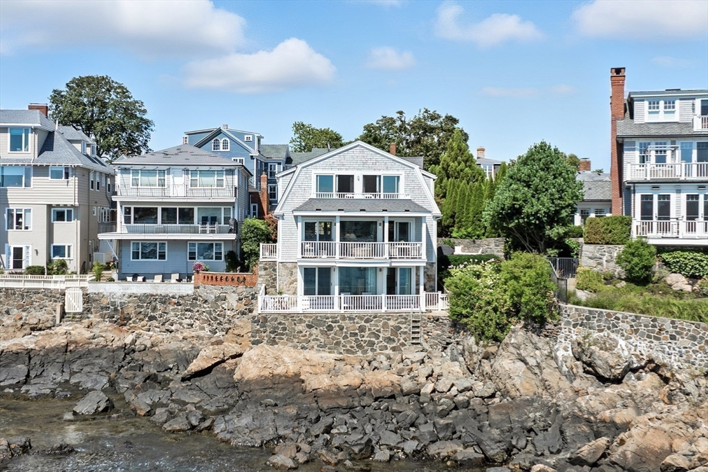 131 Front Street Marblehead, MA 01945 - Photo 37 of 41 a front view of a residential apartment building with a yard