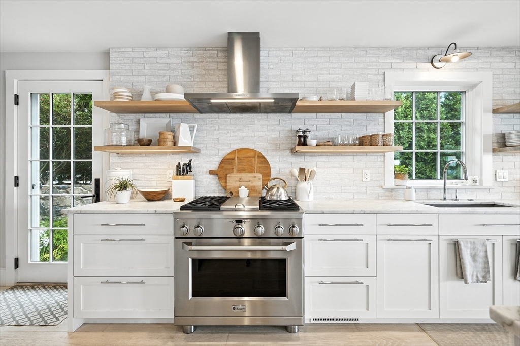 131 Front Street Marblehead, MA 01945 - Photo 10 of 41 a kitchen with granite countertop a stove and a sink