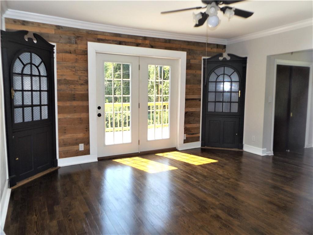 111 Hays Road Uniontown, PA 15401 - Photo 4 of 25 a view of an empty room with a window and wooden floor