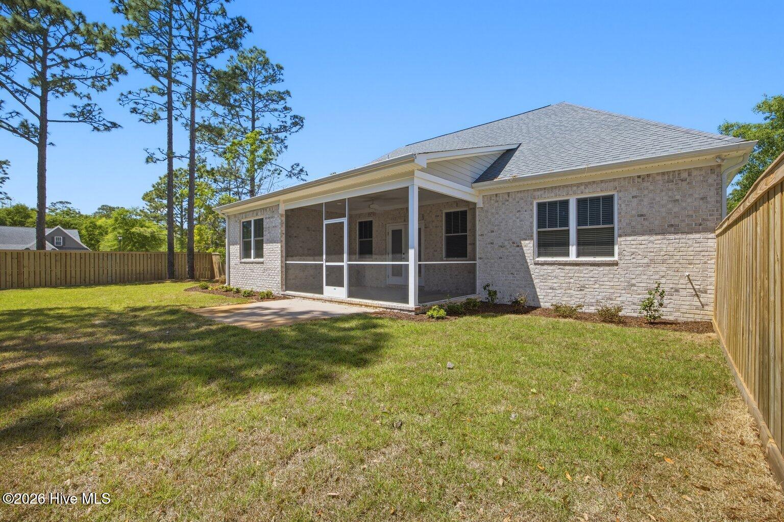 23 Stonegate Circle Hampstead, NC 28443 - Photo 22 of 69 Spacious Screened Porch leads to private backyard