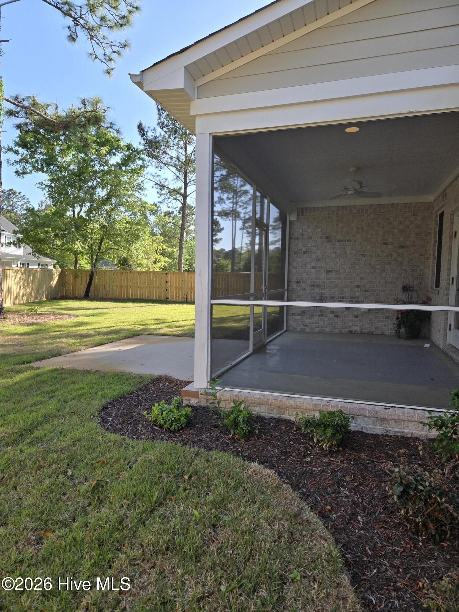 23 Stonegate Circle Hampstead, NC 28443 - Photo 23 of 64 Backyard view of screened porch and patio