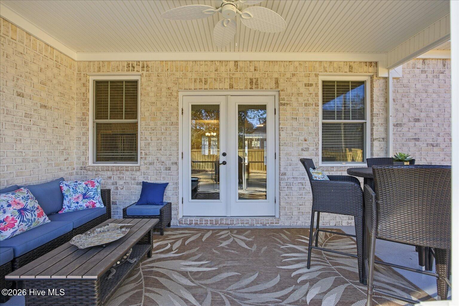 23 Stonegate Circle Hampstead, NC 28443 - Photo 25 of 64 French doors lead to the screened porch