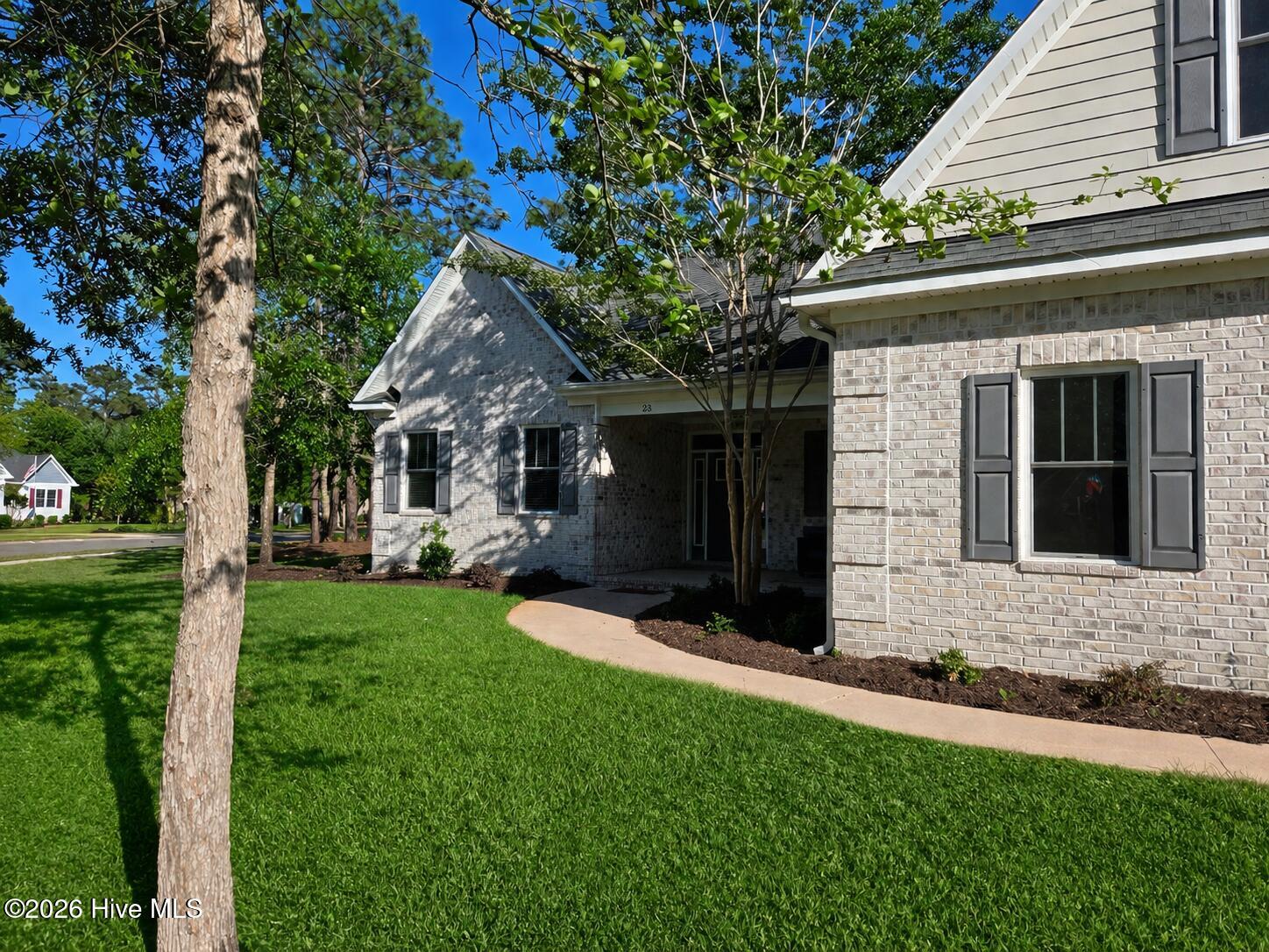 23 Stonegate Circle Hampstead, NC 28443 - Photo 3 of 64 Walkway from driveway to the front door