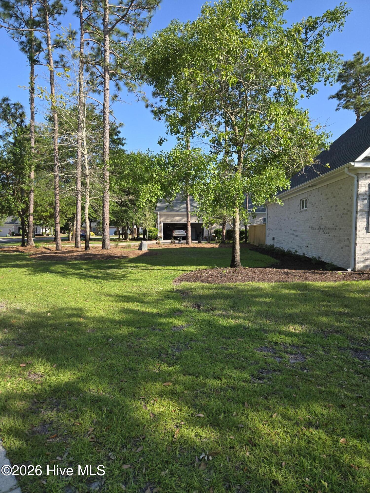 23 Stonegate Circle Hampstead, NC 28443 - Photo 45 of 69 Left side yard- extends to the sidewalk
