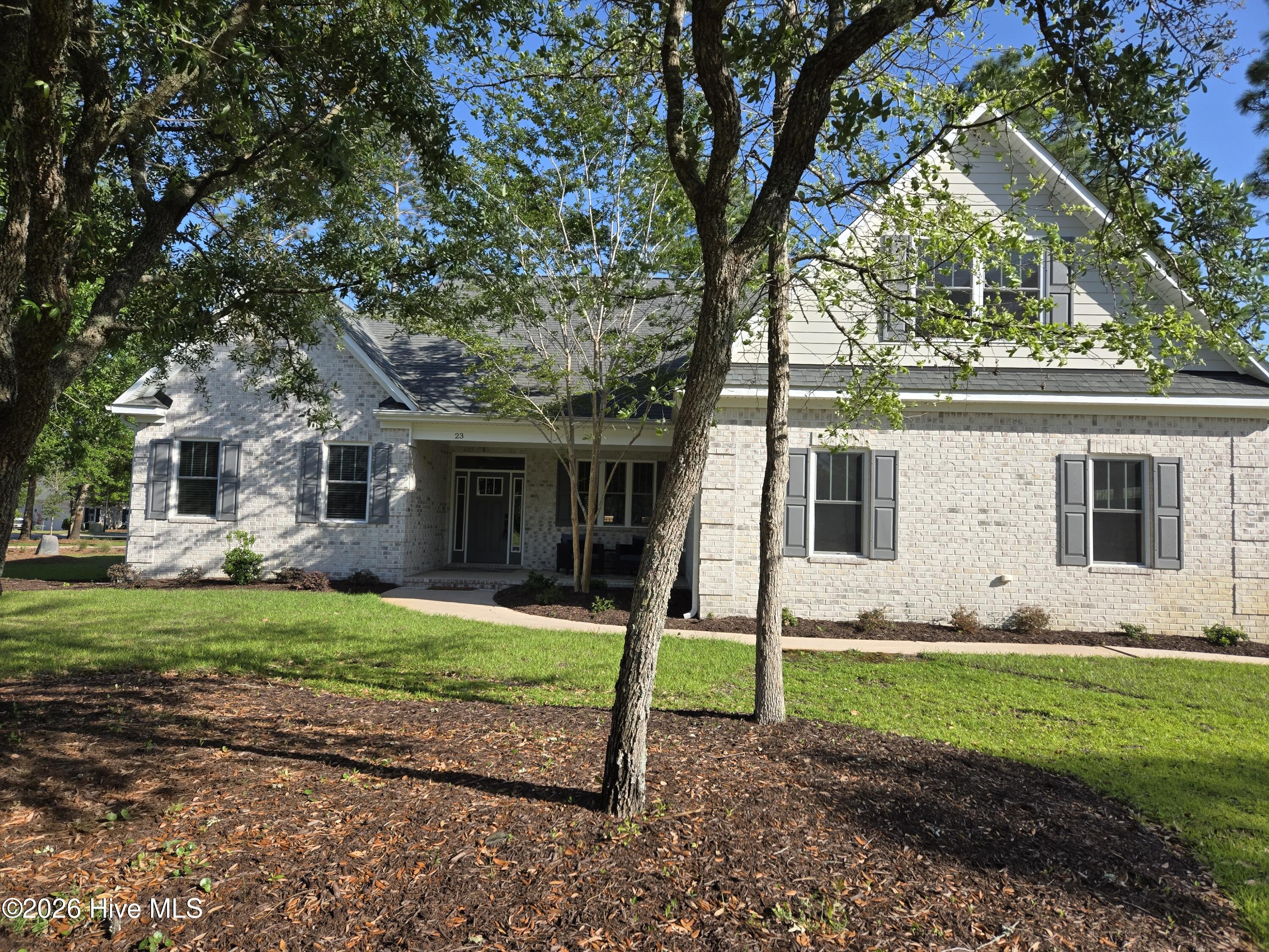 23 Stonegate Circle Hampstead, NC 28443 - Photo 4 of 64 Beautiful 4 sided brick ranch with bonus room