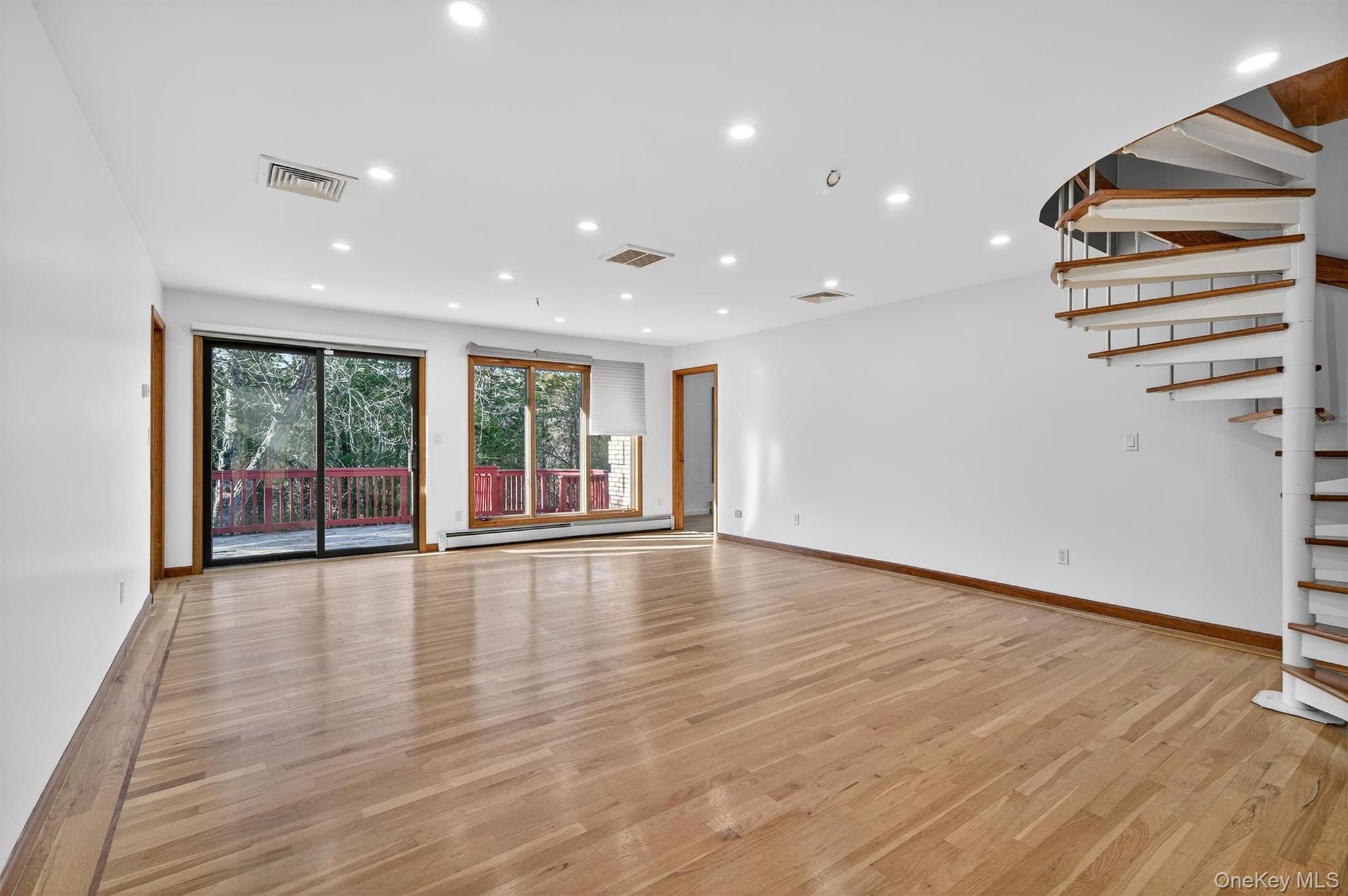 220 Oxford Road Chester, NY 10918 - Photo 21 of 50 a view of an empty room with wooden floor and a window