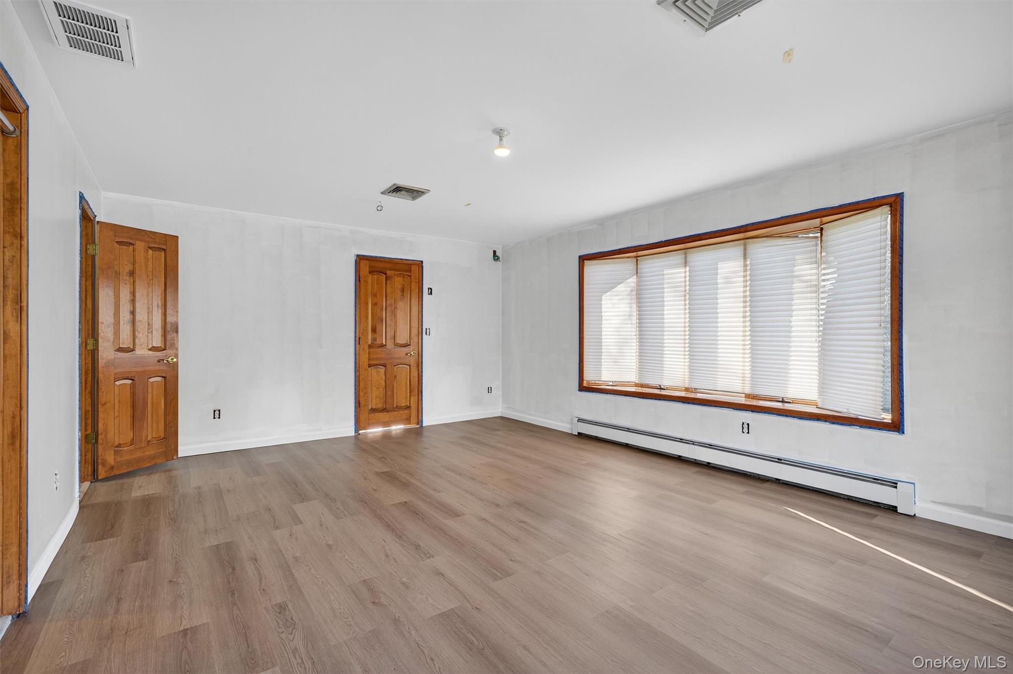 220 Oxford Road Chester, NY 10918 - Photo 25 of 50 a view of an empty room with wooden floor and a window