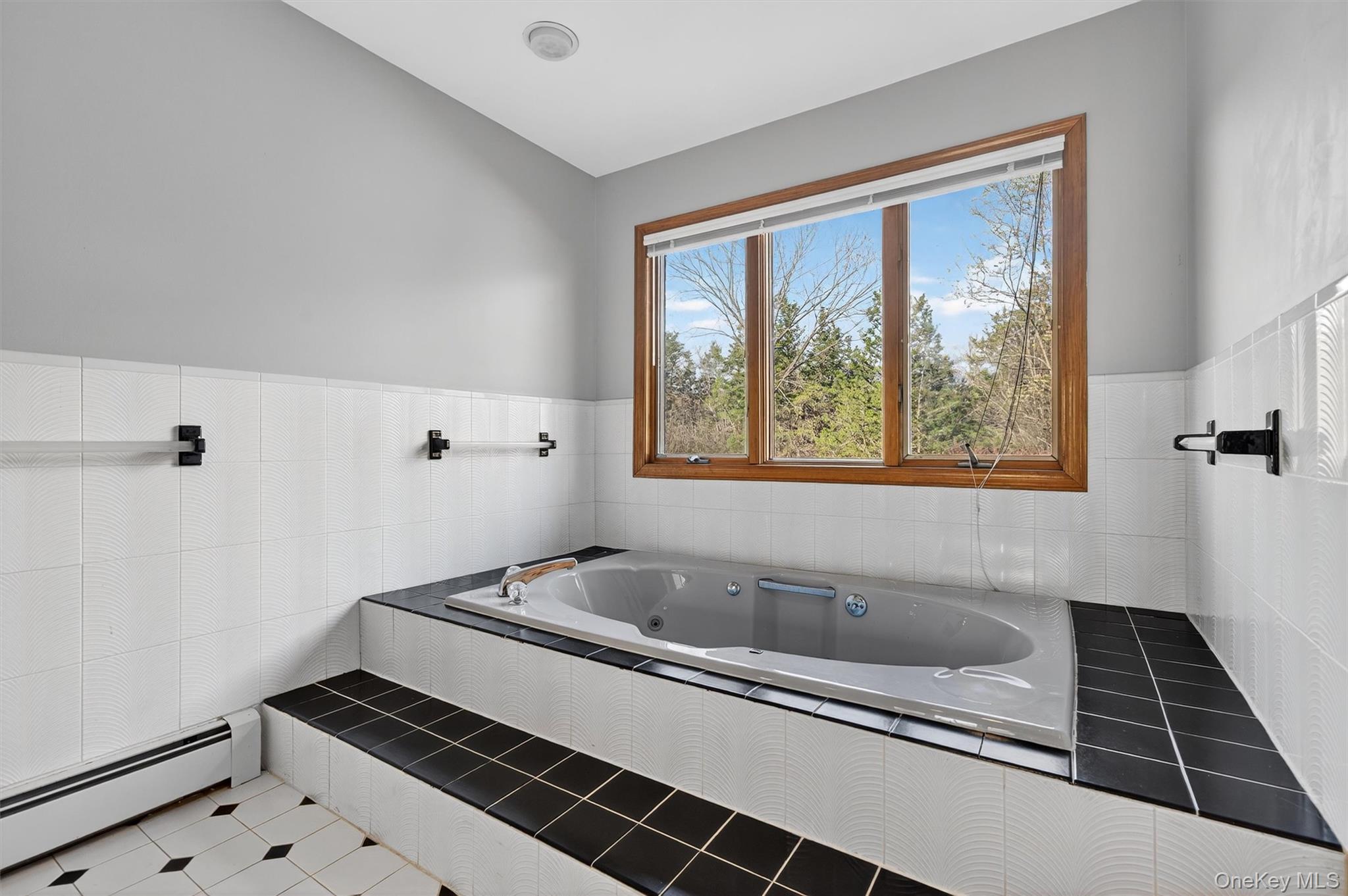 220 Oxford Road Chester, NY 10918 - Photo 29 of 50 a bathroom with a bathtub and next to a window