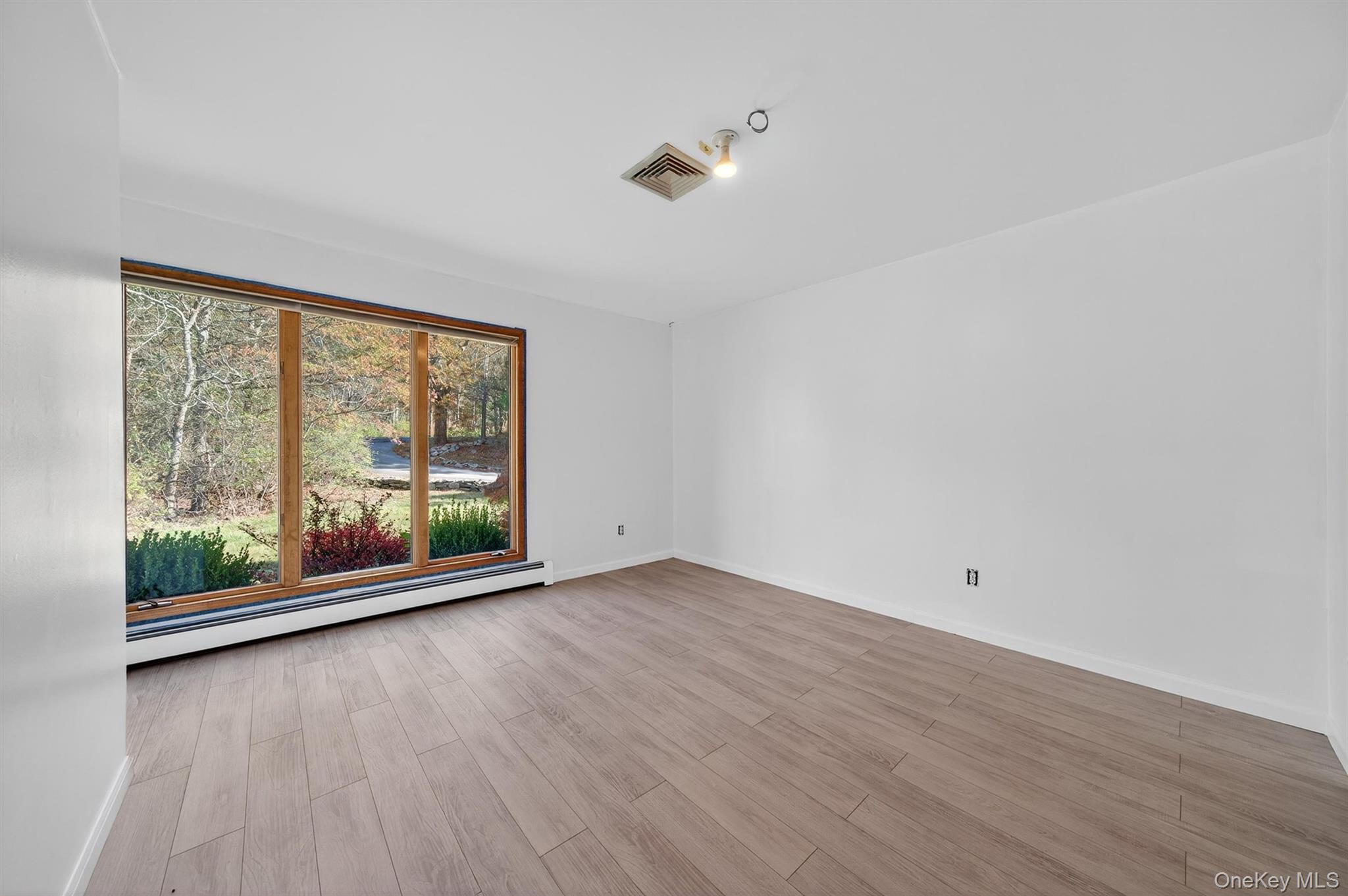 220 Oxford Road Chester, NY 10918 - Photo 31 of 50 wooden floor in an empty room with a window