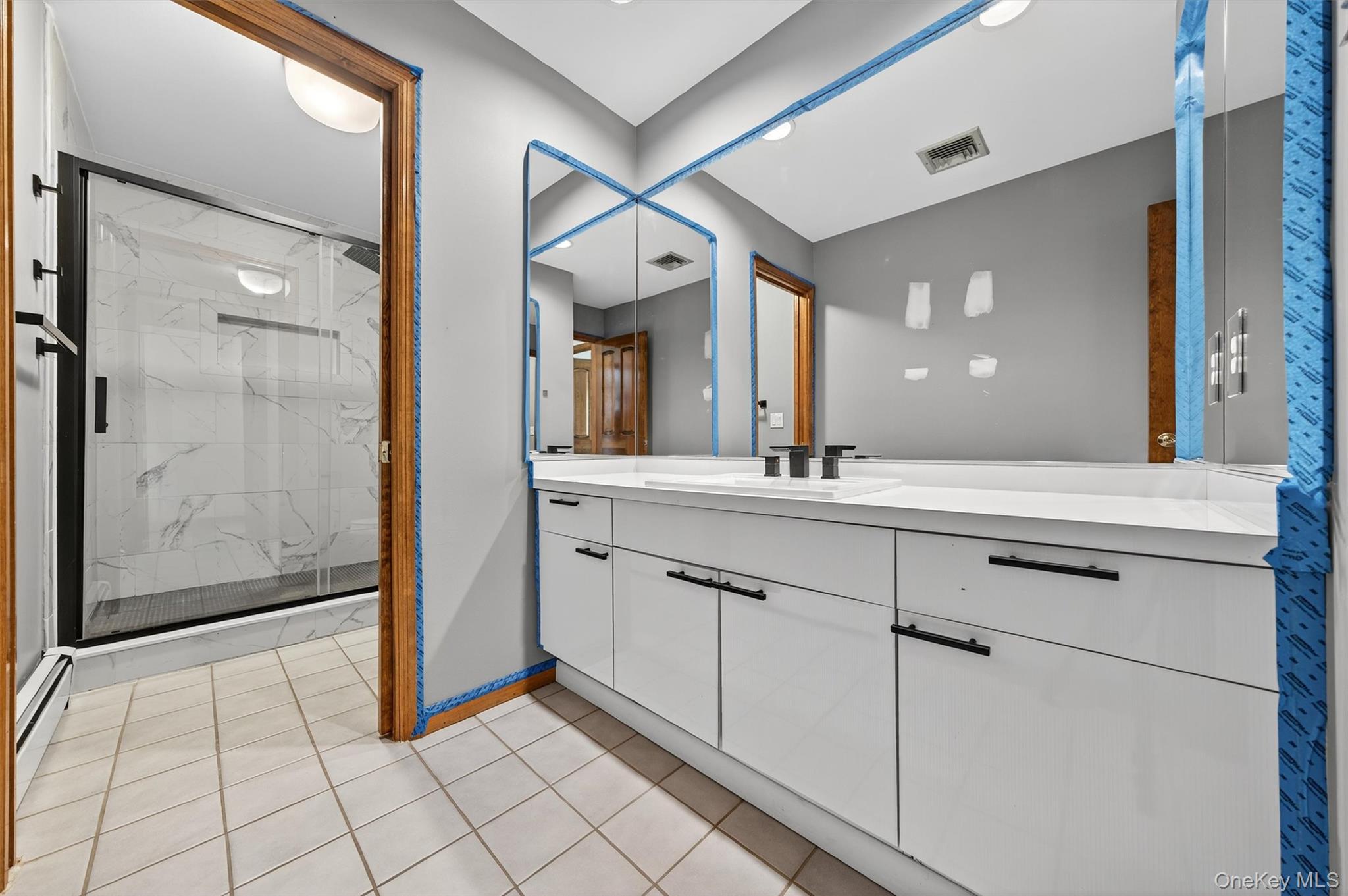 220 Oxford Road Chester, NY 10918 - Photo 34 of 50 a spacious bathroom with a shower a sink and a mirror