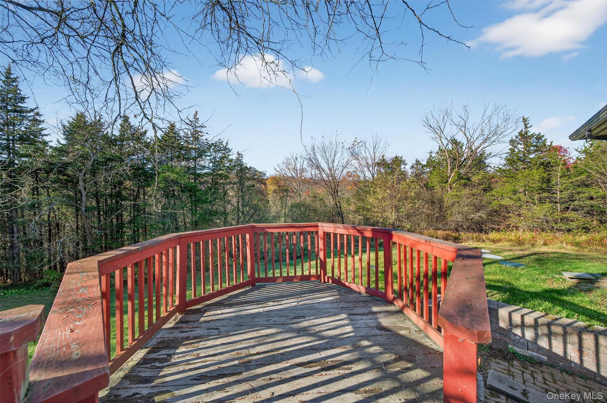 220 Oxford Road Chester, NY 10918 - Photo 45 of 50 a balcony with wooden floor and yard in the back