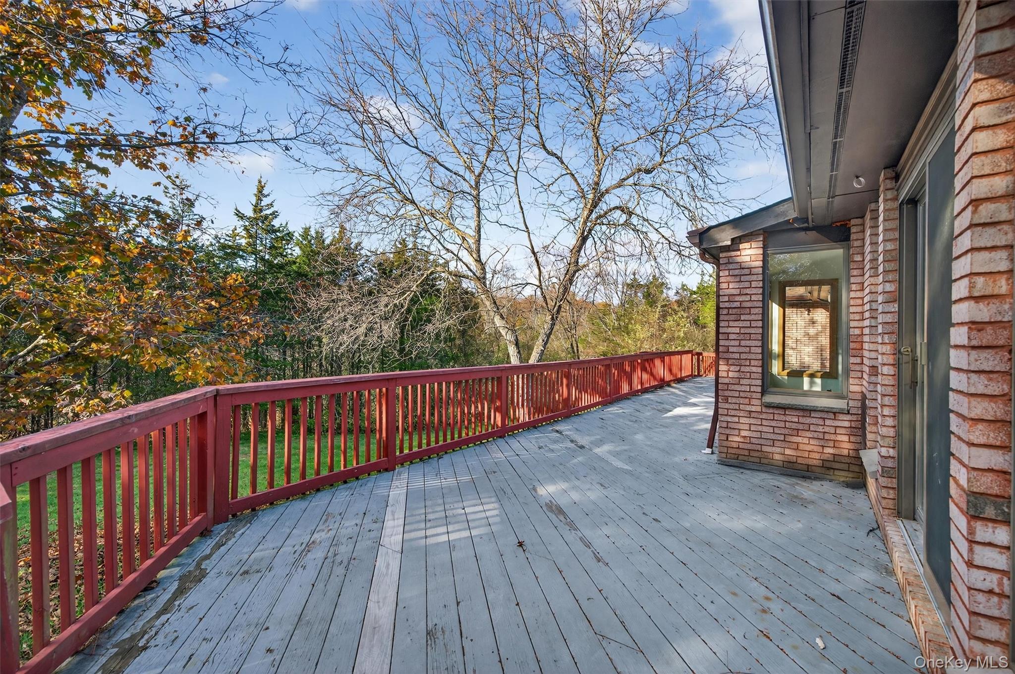 220 Oxford Road Chester, NY 10918 - Photo 46 of 50 a balcony with wooden floor and wooden fence
