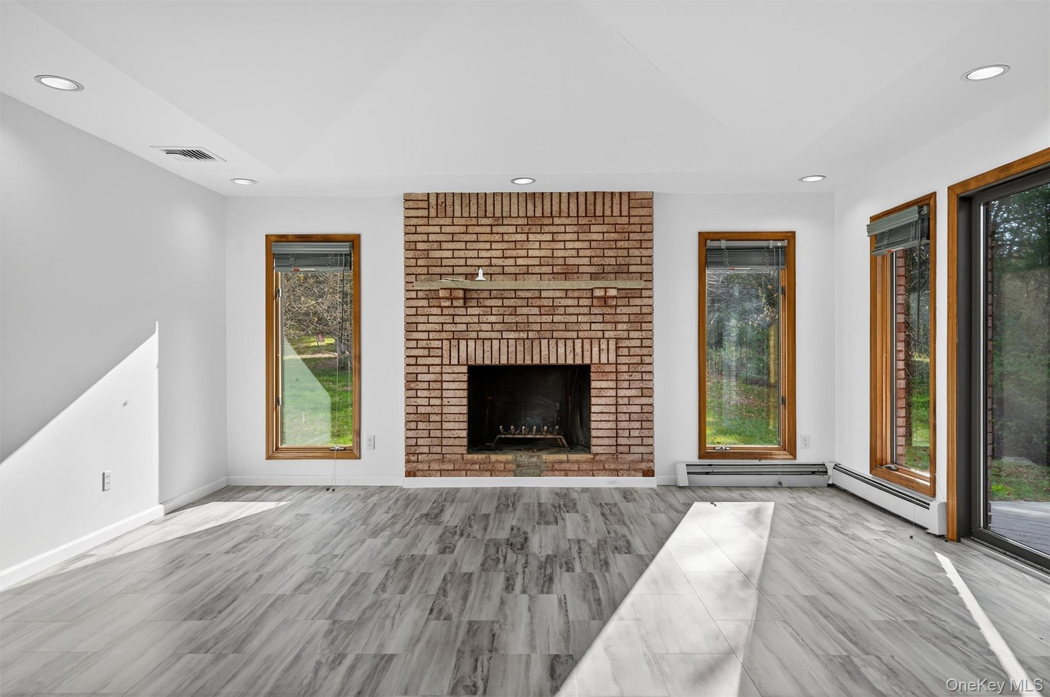220 Oxford Road Chester, NY 10918 - Photo 8 of 50 a view of an empty room with glass door and balcony