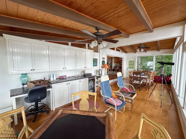 a bedroom with bed and a mirror