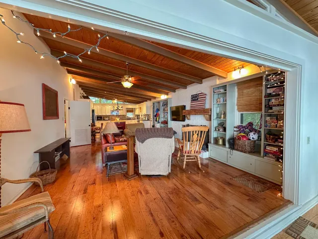 a bedroom with a bed and a tv