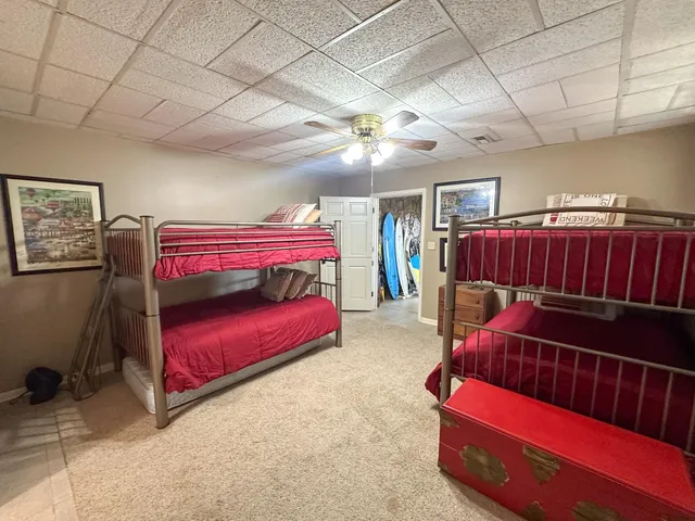 a wooden bench sitting in the middle of a lake