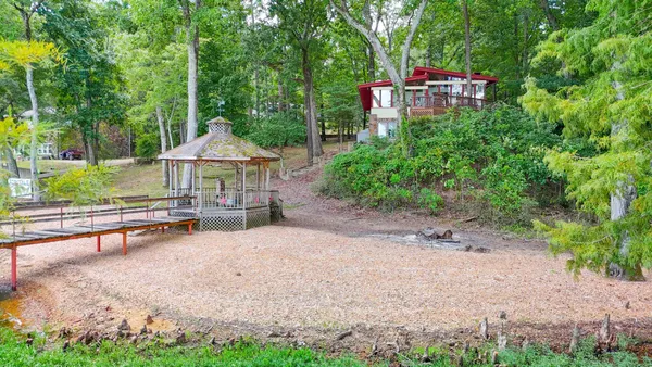 a backyard of a house with lots of green space