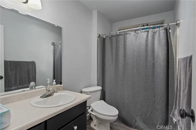 a bedroom with furniture and a chandelier