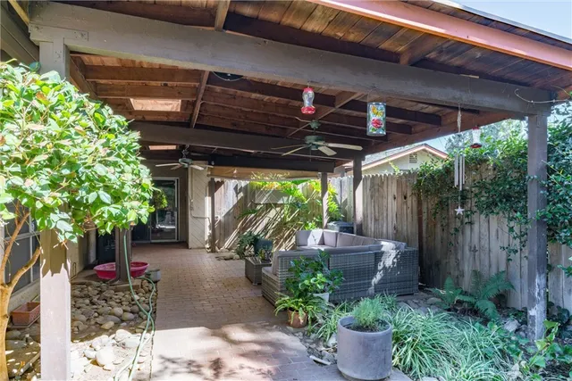 a view of a backyard with sitting area
