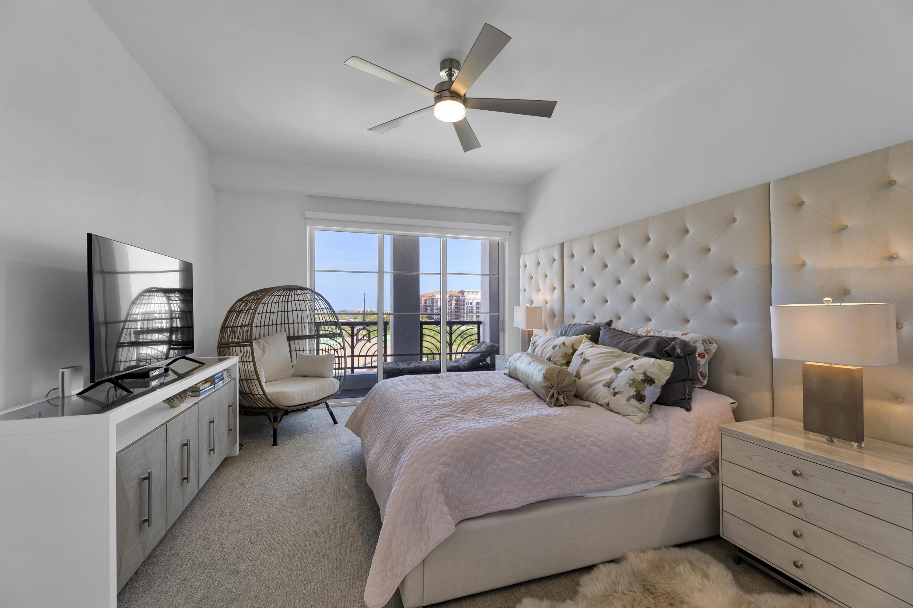 155 East Boca Raton Road, Unit 607 Boca Raton, FL 33432 - Photo 6 of 15 a bedroom with bed window and flat screen tv